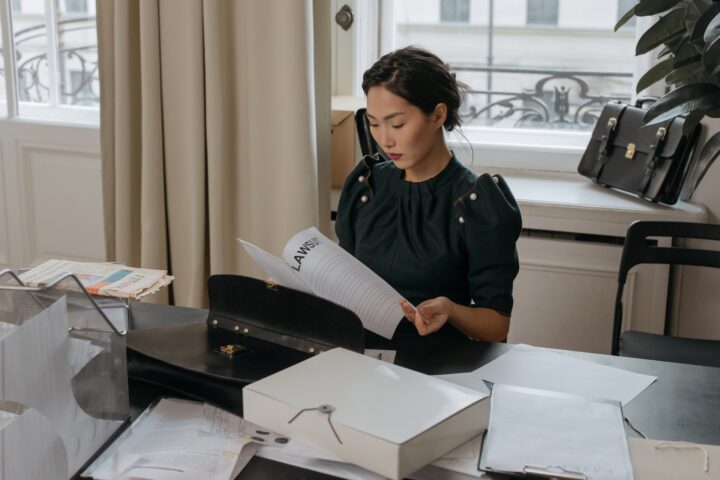 /a-woman-reading-a-document