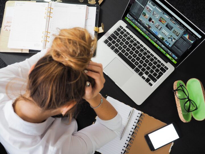 woman-sitting-in-front-of-macbook